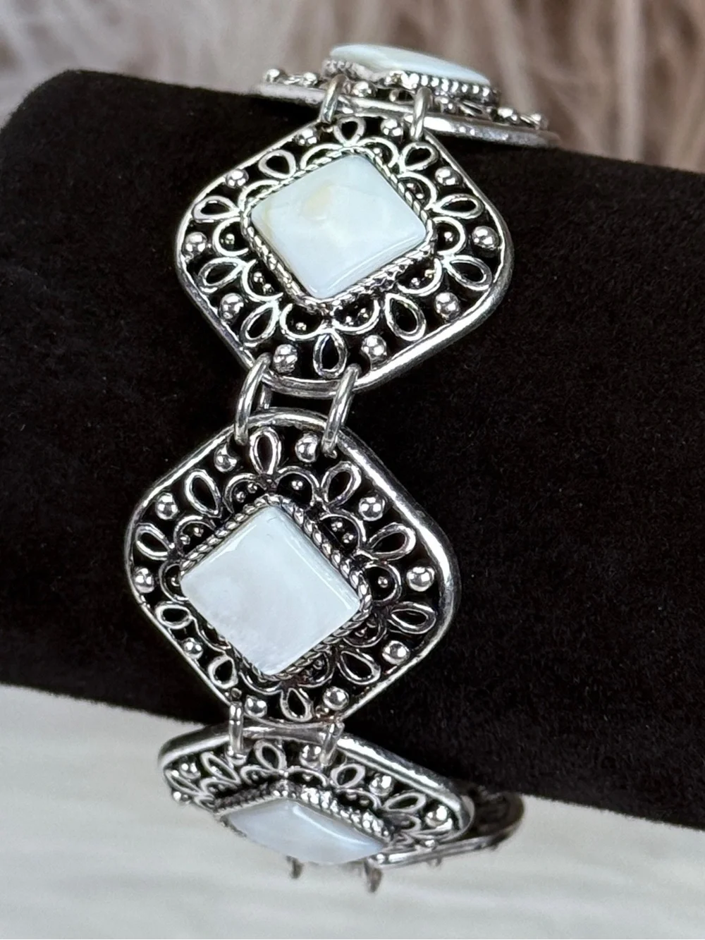 Beautiful Silvertone and white costume toggle closure bracelet